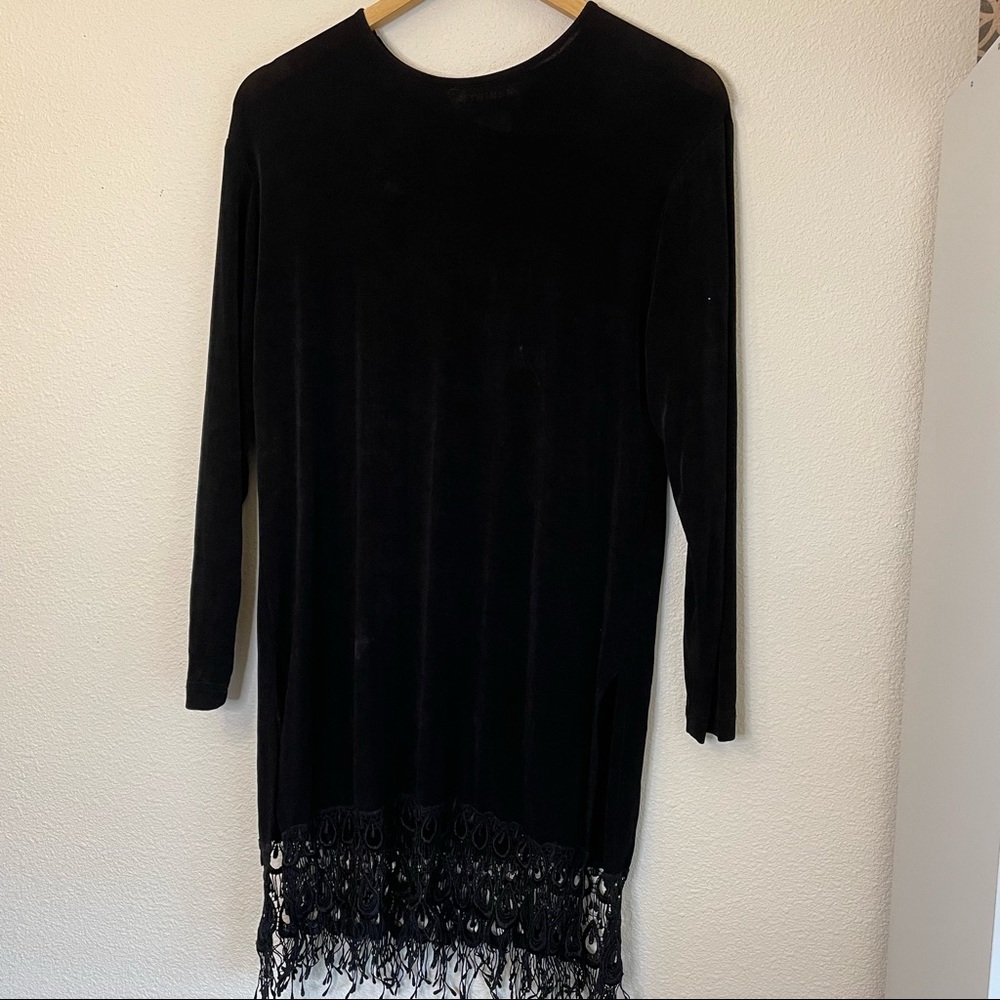 Twins Small Black long sleeve dress with fringe bottom.